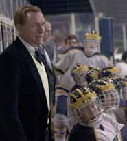 Coach Berenson with players on bench