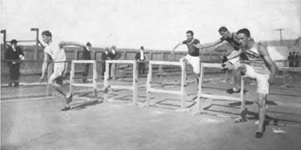Fred Schule winning 110-meter hurdles, 1904