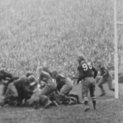 A still image from a historic football film.