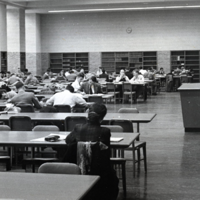 Students study at long tables within the School of Business Administration at the University of Michigan.