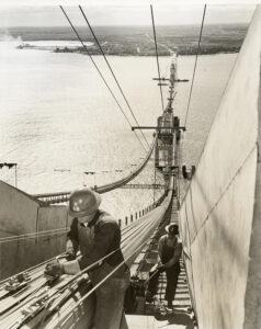 Paul Bunyan Bridge Builders adjust cable wire on the Mackinac Bridge