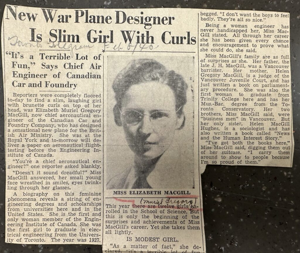 Newspaper article with headline "New War Plane Designer is Slim Girl with Curls." 