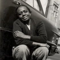 Ruth Ellis leaning against a car in Detroit.