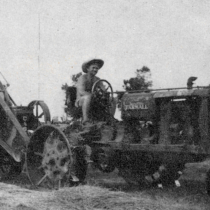 A man on a tractor at the Sunrise Farm Cooperative.