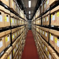 The archives at the Bentley Historical Library featuring rows of shelves full of boxes of historical papers.