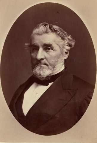 Professor Alonzo Palmer wearing a suit and bowtie. 