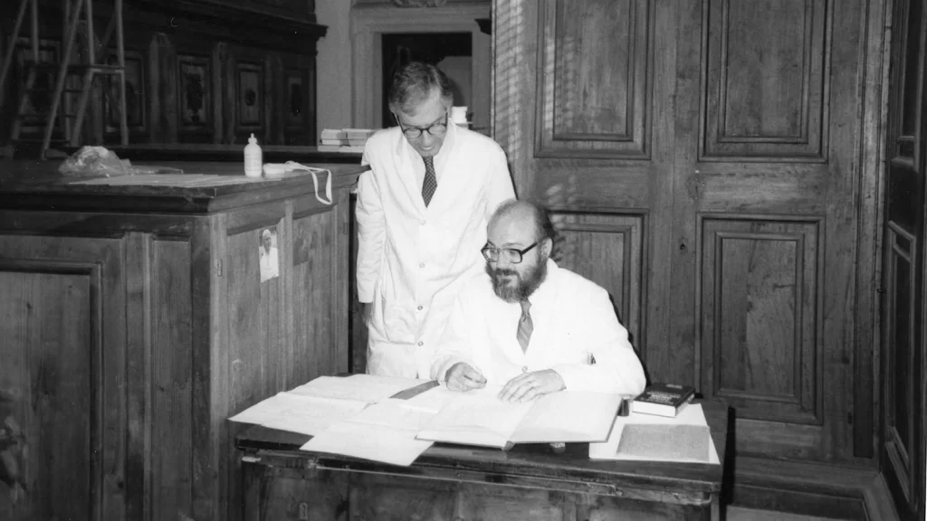 Archivists Francis Blouin and Leonard Coombs working in the Vatican Archives.
