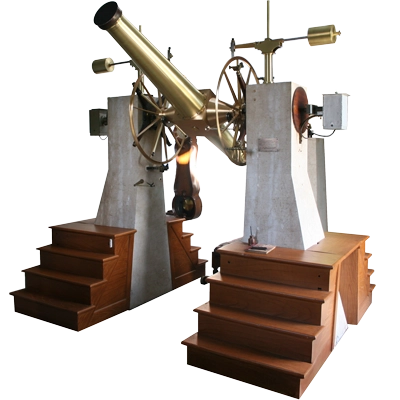 A historic brass telescope mounted on cement blocks with wooden stairs leading up to it on either side.