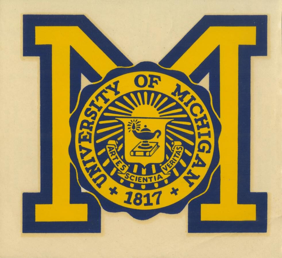 University seal in front of block M.
