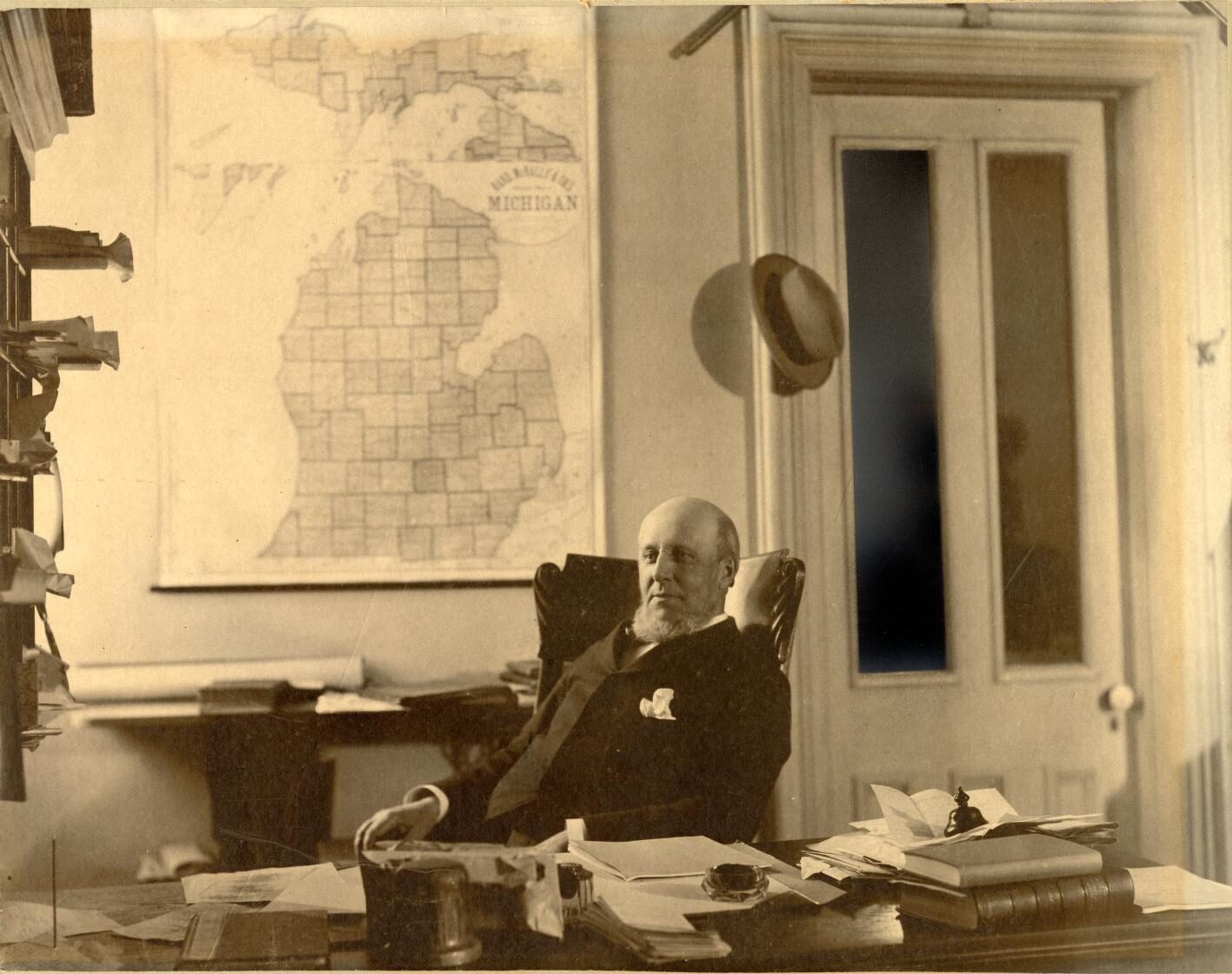 James B. Angell at his desk in the "President